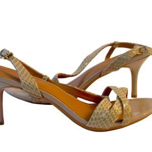 Brand: Calvin Klein
Model: Gold Metal Snake Textured Strap Heels
Women
Size: 11